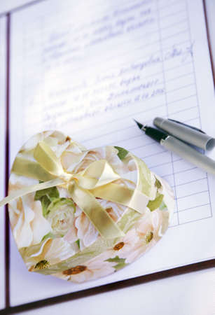 Gift box as heart and the wedding contractの写真素材