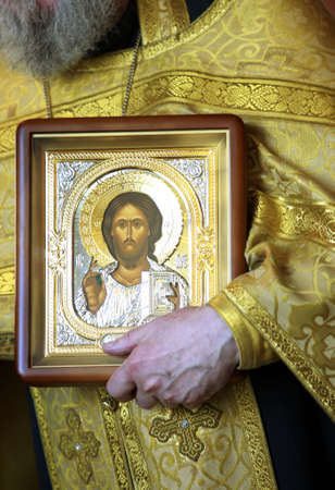 Priest with icon Jesus Christ on ceremony of weddingの写真素材