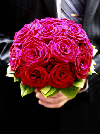 The groom holds a wedding bouquetの写真素材