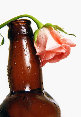 Curve brown bottle with flower on a white backgroundの写真素材