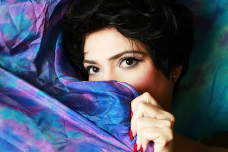 Portrait of the beautiful brunette in studioの写真素材