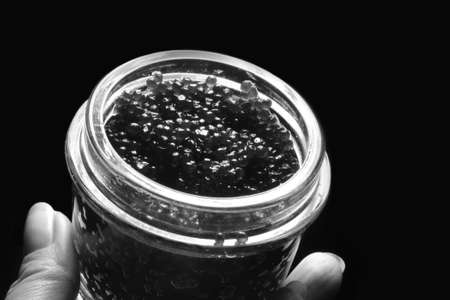 Black caviar in glass bank close-upの写真素材