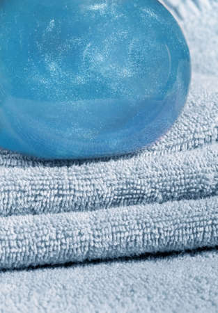 Blue towels and two bottles with blue shampooの写真素材