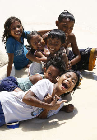 PHILIPPINES, Island BORACAY - 21 October, 2008: Five years' and seven-year cheerful unidentified Philippine children at coast of ocean. Island Boracay, Philippines, 21 October, 2008 on.のeditorial素材