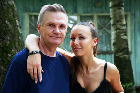 The girl with the grandfather on a summer residenceの写真素材