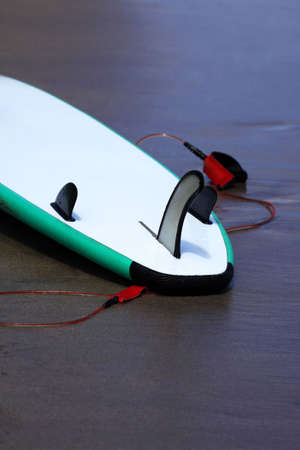 Board for surfing on a coast of oceanの写真素材