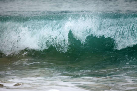 Big wave crashes on to the shore. Indian oceanの写真素材