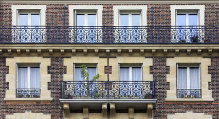 The facade of apartment building in Parisの写真素材