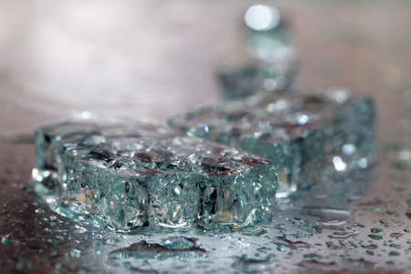 The broken glass with drops is strongly dimの写真素材