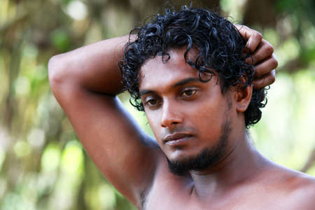 Portrait young men on a green background. Sri Lankaの写真素材