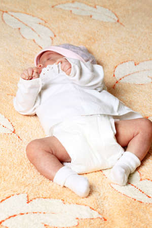 New born baby girl peacefully sleepingの写真素材