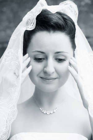 Portrait of the beautiful bride in a veilの写真素材