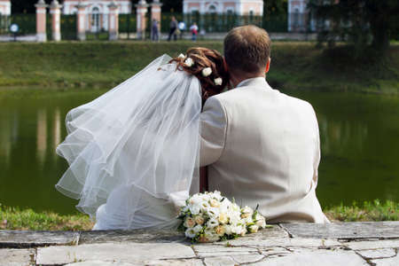 Beautiful newly married pair in parkの写真素材