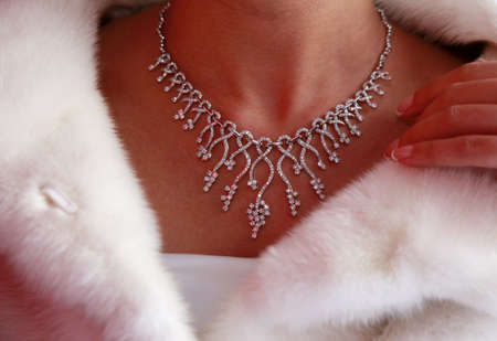 Wedding diamond necklace on a neck of the brideの写真素材