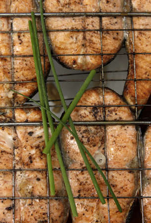 Fried sea fish. Preparation on open fireの写真素材