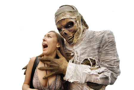 Mummies bandaged and decomposing hand grabs the young woman  の写真素材