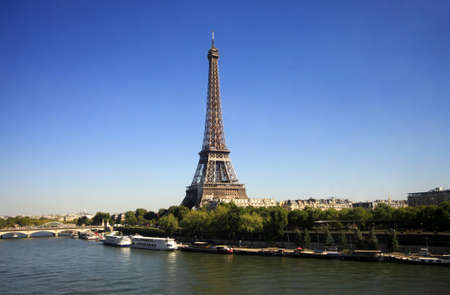 Eiffel Tower in Paris on a background of the blue sky. France