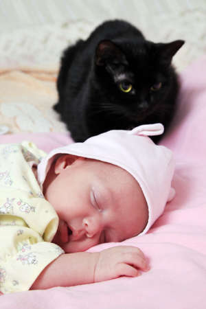 New born baby girl peacefully sleepingの写真素材