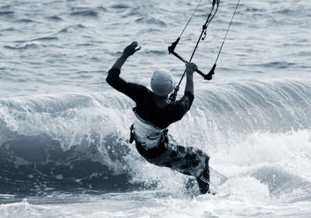 Kiteboarder enjoy surfing in ocean. Vietnam