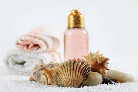 Accessories for a bath with cockleshells on a white backgroundの写真素材