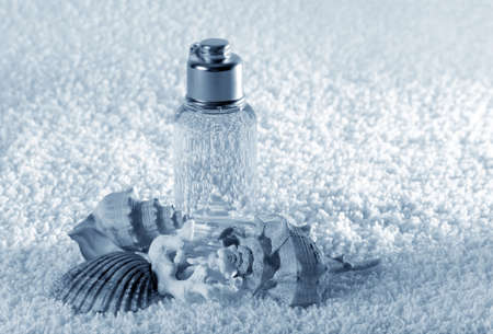 Accessories for a bath with cockleshells on a white backgroundの写真素材