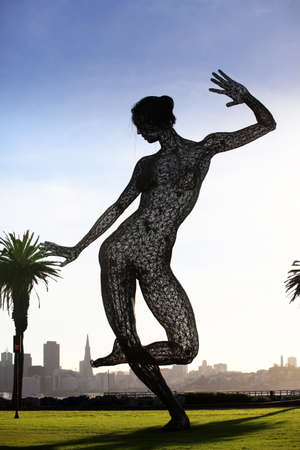 SAN FRANCISCO-OCT 24: 40-foot mesh sculpture of a woman called Bliss Dance by artist Marco Cochrane on Treasure Island in San Francisco on Oct. 24,2012. Night viewers can alter lights with a phone app.のeditorial素材