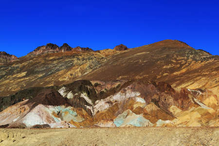 The variegated slopes of Artists Palette in Death Valley, California. Various mineral pigments have colored the volcanic deposits found here.の写真素材