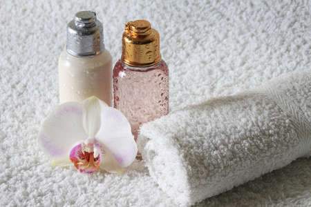 Accessories for a bath with flower on a white background