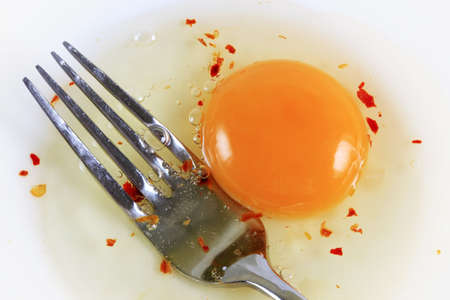 The image of a plug and broken eggの写真素材