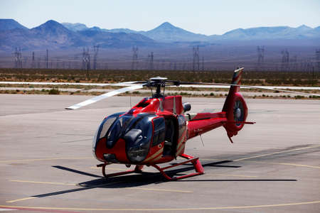 Helicopter starting from restricted fenced base near Grand Canyon