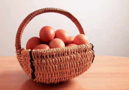 Chicken brown eggs  in in a wicker basket