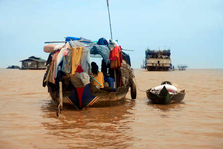 SIEM REAP, CAMBODIA - APRIL 06: An unidentified woman on a floating village on Tonle Sap lake in Siem Reap, Cambodia on April 06, 2014. のeditorial素材