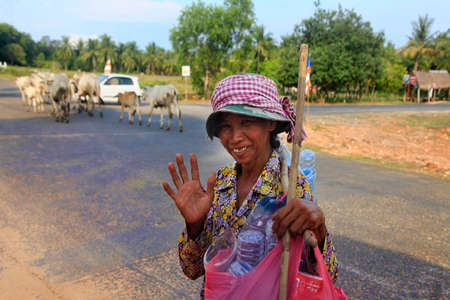 SIHANOUKVILLE, CAMBODIA - APRIL 17, 2014: An unknown old woman greeted with a smile in Sihanoukville, 17 April 2014, Cambodiaのeditorial素材