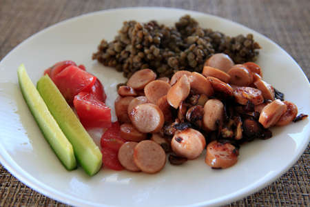 cut sausage with fresh cucumbers and tomatoの写真素材