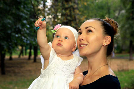 Happy mother and daughter in the parkの写真素材