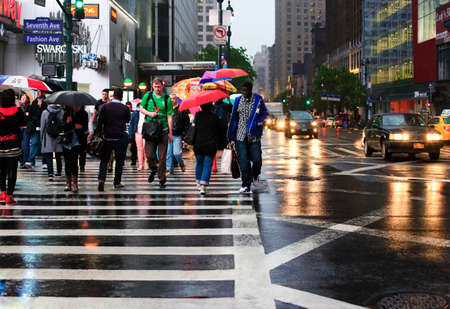 NEW YORK CITY, NY, USA - MAY 20, 2013:  people walking on the crosswalk in Broadway Street in Manhattan, New Yorkのeditorial素材