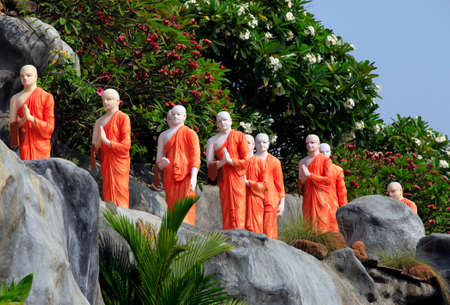 Long line of monks in orange robas in Dambulla, Sri Lankaのeditorial素材