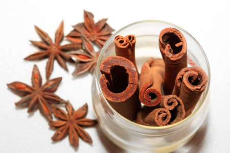 anice and cinnamon isolated on white backgroundの写真素材