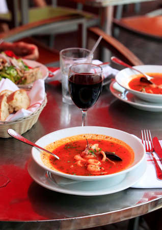 Bowl of spicy fish soup with tomatoes and musselsの写真素材