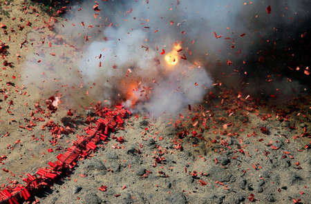 Chinese fireworks with fire and smokeの写真素材