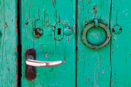 Wooden old door with iron handleの写真素材