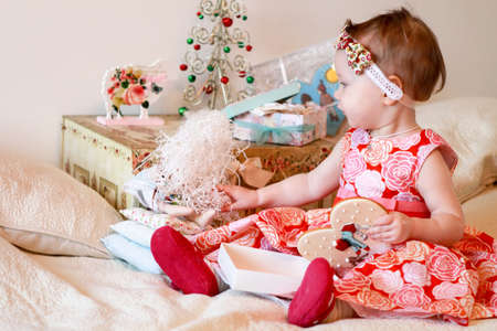 Portrait of little girl with a giftsの写真素材