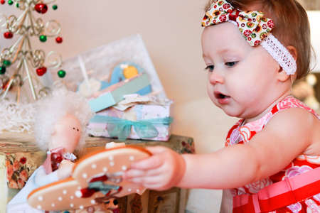 Portrait of little girl with a giftsの写真素材