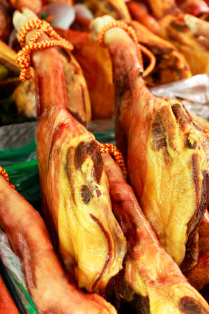 Prosciutto hams ready for sale at the marketの写真素材