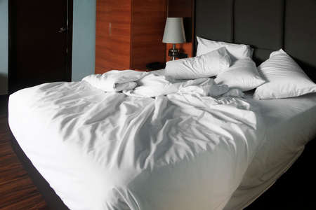 Double bed in the hotel roomの写真素材
