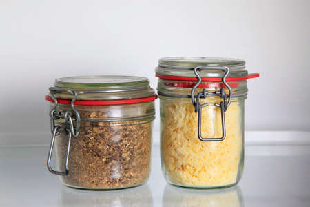 Glass jars on the shelf of the refrigeratorの写真素材