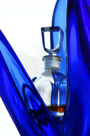 Bottle with perfumery on an abstract backgroundの写真素材