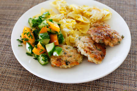 Chicken cutlets with pasta and fresh tomatoes