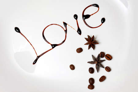 Love written with dark cocoa isolated in whiteの写真素材