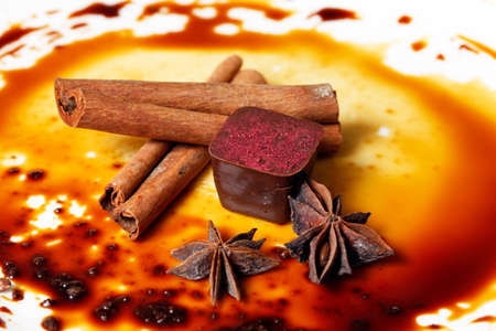 Chocolate candy isolated with anice and cinnamonの写真素材